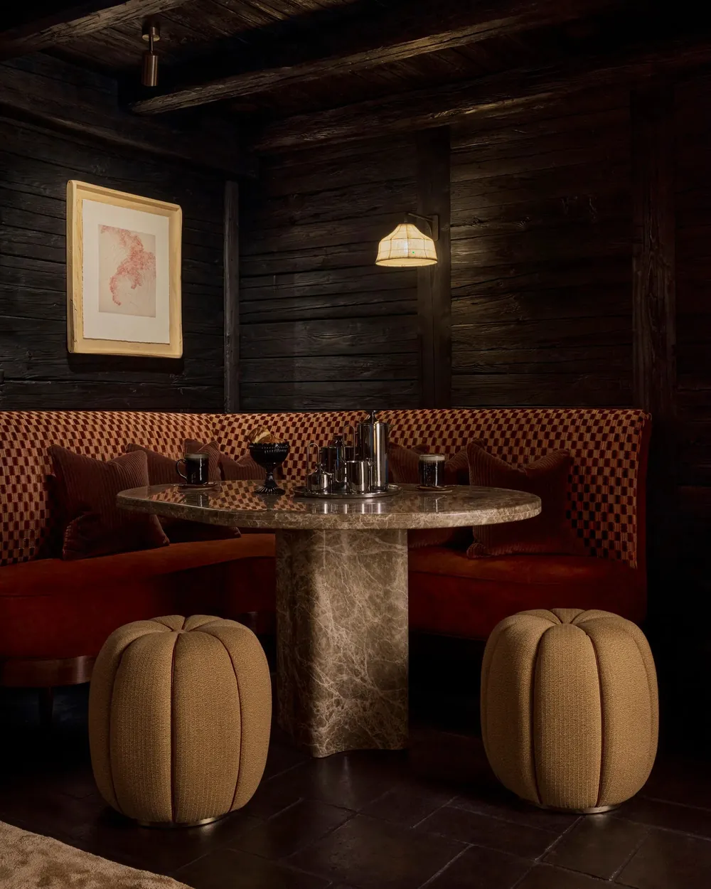 Dark Emperador marble table by Onur Akkaya in the Carnotzet of a Crans-Montana chalet designed by Linda Boronkay